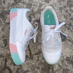 Women’s white Puma sneakers
